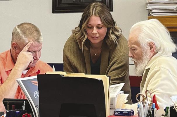 RAY COUNTY Presiding Commissioner Billy Gaines (from left), Humane Society of Ray County (HSRC) President Atalie Blackwell and Eastern Commissioner Dave Powell watch a video of HSRC building issues. SOPHIA BALES | Staff