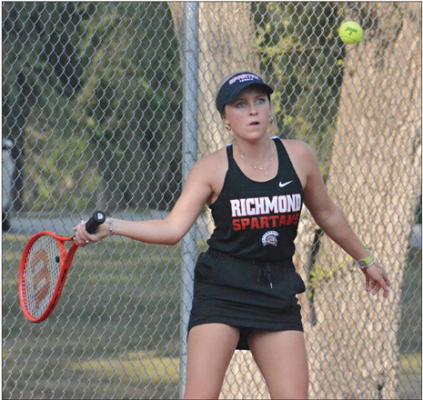 SENIOR HAILEE GREEN keeps her eye on the ball as she prepares to hit a return show during Richmond’s Sept. 21 Senior Night dual with Lexington at Maurice Roberts Park.