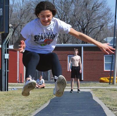 ORRICK FIRST-YEAR high schooler Anela Fletcher, who plans to run the hurdles this season, gets in some jumping, too, March 15 at the school track. SHAWN RONEY | Staff