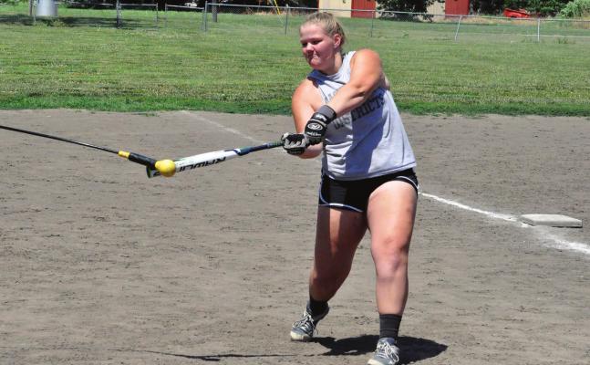 HARDIN-CENTRAL senior Morgan Finley practices her swing Tuesday during a camp for grades 7-12. SHAWN RONEY | Staff