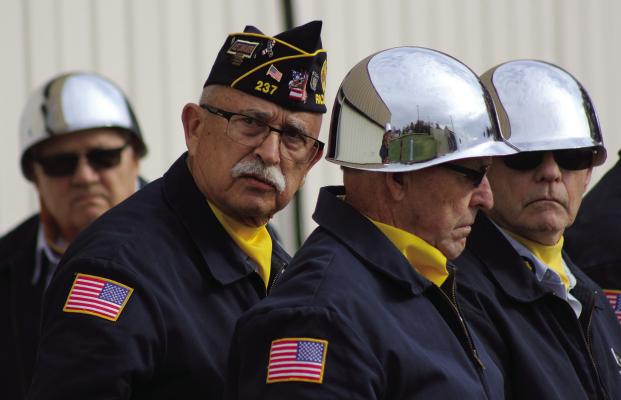 BILL CAIN (from left), Jim Edens, Brian Nichols and Jim Richardson of the American Legion Post #237 participate in their Veteran’s Day Program. SOPHIA BALES | Staff