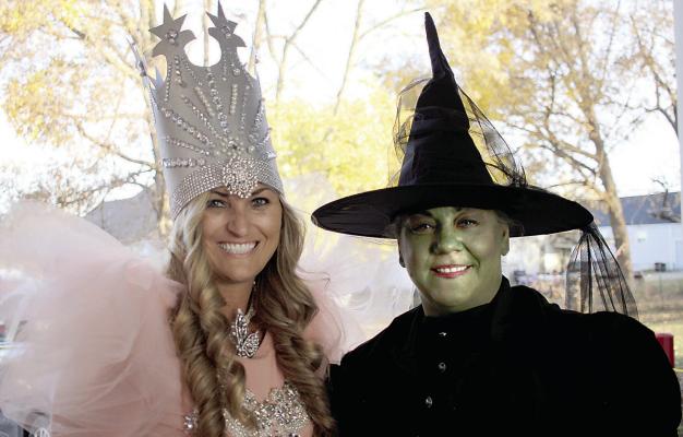 Haley Williams as Glinda the good witch and Tonya Willim, the wicked witch of the west were at the drive-through trick or treating with the City of Richmond and the fire department on Halloween evening. SOPHIA BALES | Staff