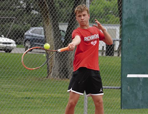 FELIX DE HESSELLE coolly keeps his eye on the ball as he hits a forehand shot from around the baseline during his singles sectional match with Excelsior Springs’ Carter Pitts May 12 at Maurice Roberts Park in Richmond. SHAWN RONEY | Staff