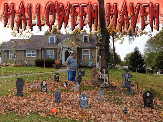 AT 707 E. LEXINGTON ST., Tim Glynn walks across his front yard and crunches into the leaf-strewn graveyard created for expected Halloween visitors. J.C. VENTIMIGLIA | Staff