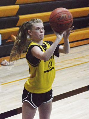 ADDISON CHAPMAN attempts a perimeter shot during Orrick’s combined practice with Hardin-Central July 13 in the Orrick High School gym. SHAWN RONEY | Staff