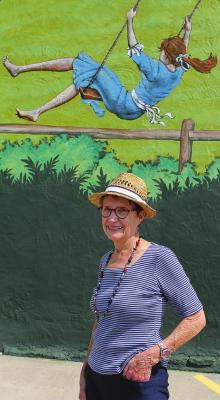 THE SKETCH artist for the mural, Patricia Pierce, stands in front of the completed mural. J.C. VENTIMIGLIA | Staff
