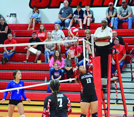 TIARA SMITH (No. 19) has the attention of spectators and players alike as she attempts a set shot Oct. 5 in the Richmond High School gym.