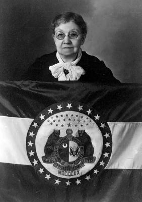MARIE OLIVER standing behind the original Missouri State Flag she designed, c. 1943. STATE HISTORICAL SOCIETY OF MISSOURI | Submitted