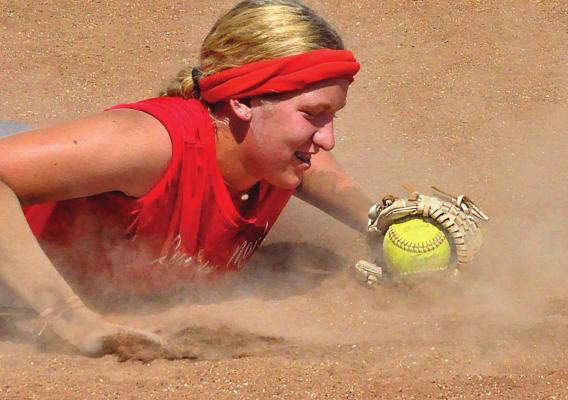 HAYLEE WEBER hits the dirt during a Richmond softball practice Aug. 21 at Southview Park. SHAWN RONEY | Staff