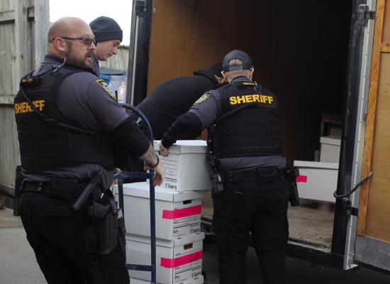 RAY COUNTY SHERIFF jailers and deputies place records in an enclosed trailer to go to the sheriff’s department on Tuesday. SOPHIA BALES | Staff
