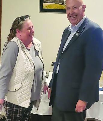 JANEY TAYLOR (left) chats with State Representative Terry Thompson during an afterhours hosted by Community Bank of Missouri and Shirkey Golf Course.