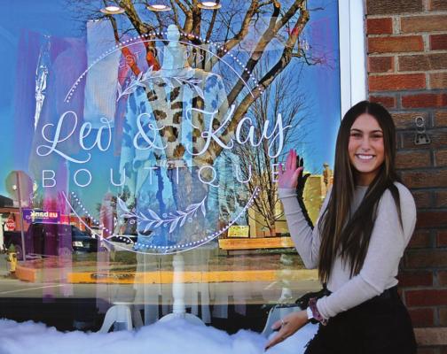 OWNER Peyton Bowman, 19, shows off the window to her boutique, Leo and Kay, which opens Dec. 11 at 103 W. Main St., Richmond, across from the Ray County Courthouse. J.C. VENTIMIGLIA | Staff