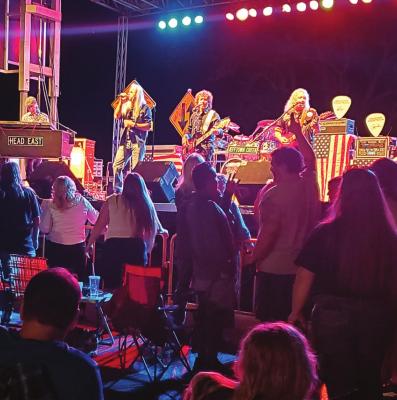 HEAD EAST, known for hits including “Never Been Any Reason,” plays in Richmond on the stage created by Branded Steakhouse, Oink &amp; Moo BBQ &amp; Taproom. Restaurant owner Randy Huffman says there is more to come. JANIS KINCAID