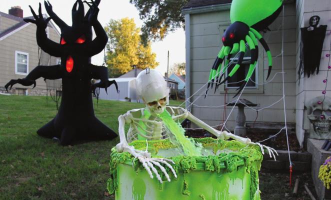AT 707 AND 705 E. Lexington St., Richmond, this skeleton must have bellowed to a frat boy or sorority girl in life, because in death there is a constant stream of green ookiness pouring from his mouth. J.C. VENTIMIGLIA | Staff