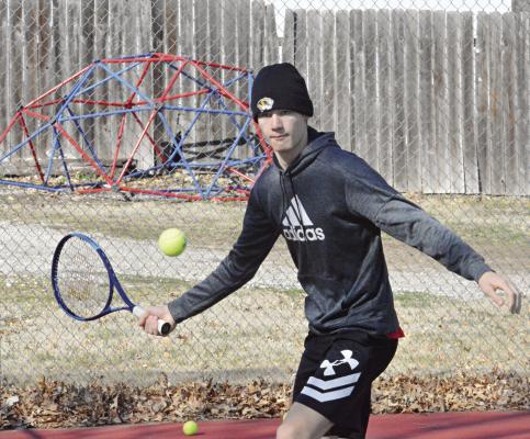 JUNIOR GABE BAKER practices his baseline forehand return shot March 14 at Maurice Roberts Park in Richmond. SHAWN RONEY | Staff