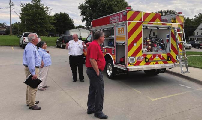 THE NEW TRUCK is viewed, from left, by City Attorney Chris Williams, Councilwoman Deanna Guy, Fire Chief Mark Sowder and Mayor Mike Wright. BRIAN RICE | Staff