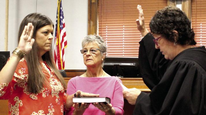 Heather Pugh (from left) is being sworn in by Laura Wrisinger and Ray County Judge Lori Baskins. Pugh took on a role with Missouri Developmental Disabilities Council last week. SOPHIA BALES | Staff