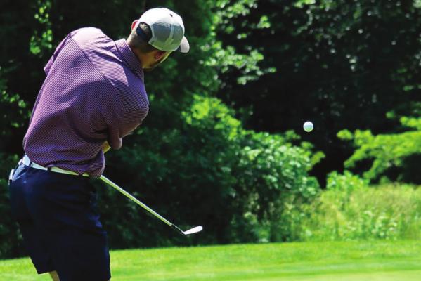 DYLAN COMSTOCK, seen here attempting a chip shot during an early June tournament at Drumm Farm Golf Course in Independence, finishes five strokes from par Monday in Kansas City Junior Tour competition. Comstock will be a high school senior this fall at Orrick. SHAWN RONEY | Staff
