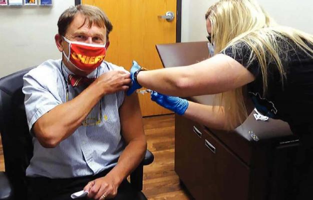 DHSS Director Randall Williams gets a flu shot, something he urges all older Missourians to get.