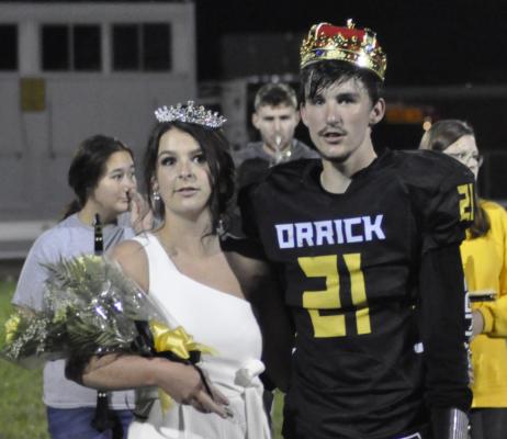 SHAWN RONEY | Staff SENIORS MAYCE MILLER, left, and Ethan Wilson bask in the glow of being crowned homecoming queen and king Sept. 11 at Orrick.