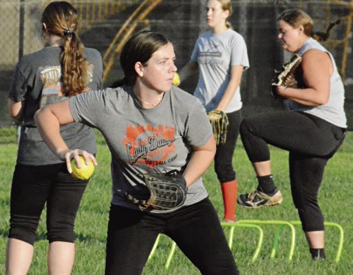 LIBBY FIFER sets to throw during infield drills Aug. 11 at Norborne. SHAWN RONEY | Staff