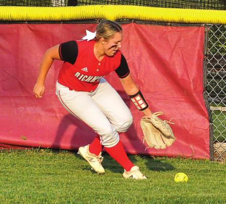 AIREANNA HOEPPER chases down a base hit to right field Monday against Excelsior Springs.