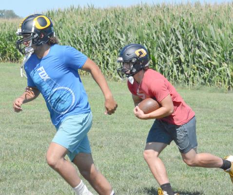 ORRICK SENIOR Milo Nay, left, leads for Jaxon MIller Aug. 9 on the Orrick practice field as the Bearcats prep for the 2022 8-man football season, slated to start Friday against St. Paul Lutheran in Concordia. SHAWN RONEY | Staff