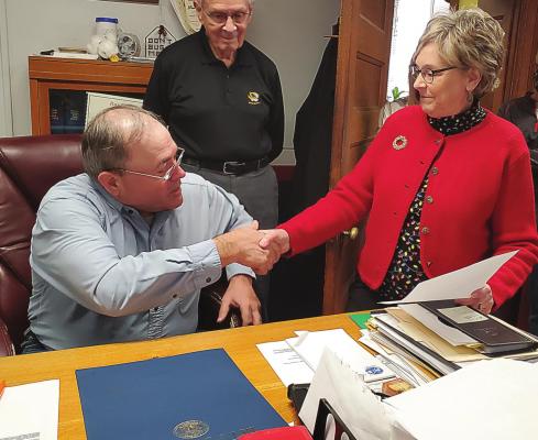 RAY COUNTY Eastern Commissioner Allen Dale receives a House resolution of recognition, upon his pending retirement, from state Rep. Peggy McGaugh during the commission’s Dec. 18 meeting. Behind them stands Presiding Commissioner Bob King. JANIS KINCAID | Submitted photo