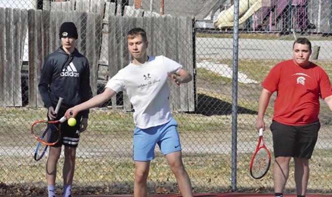 RICHMOND TENNIS COACH Brett Terry plans for his Spartans, some of whom are seen here practicing in mid-March at Southview Park, to play some “challenge matches” as they prep for their April 11 road dual with Carrollton. SHAWN RONEY | Staff