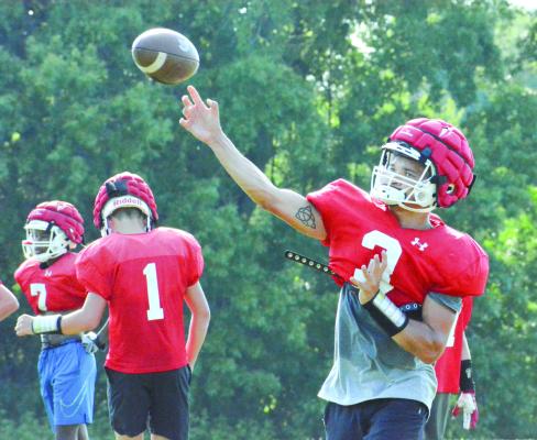 QUARTERBACK DONIVIN WILLIAMS throws to Richmond’s receivers as the Spartans train Aug. 12 on their practice field to prep for the season, set to begin Saturday against New Madrid County Central in St. Genevieve. SHAWN RONEY | Staff