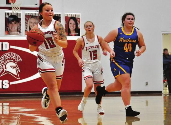 SSKYLAR QUICK pushes the ball for Richmond Tuesday in her last game on her home basketball court. HAWN RONEY | Richmond News