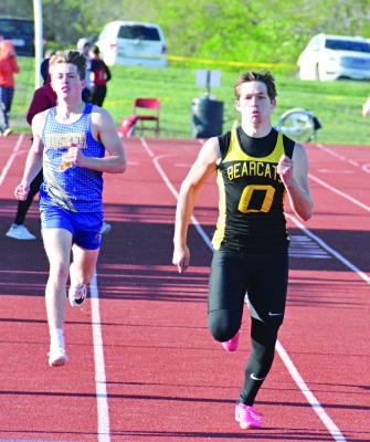 ORRICK SOPHOMORE Jeff Rohde looks to finish strong and fight off a challenge on his right during his heat of the boys 400-meter dash at the Bruce Finlayson Invitational April 21 at Carrollton. SHAWN RONEY | Staff
