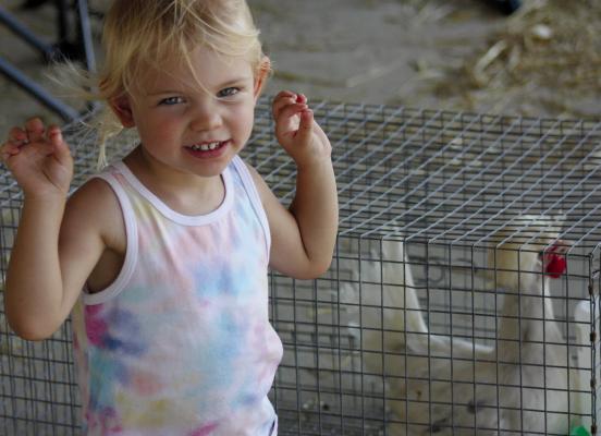 MCKENNA CLEVENGER dances near her sister’s chickens before the poultry show. See pages 5 through 10 for more fair coverage. SOPHIA BALES | Staff