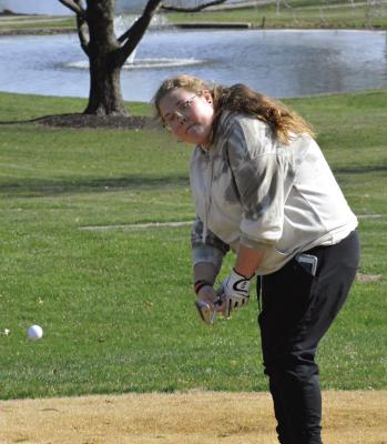 ORRICK SOPHOMORE Shelbie McElwee works on her short game Monday afternoon at the Excelsior Springs Golf Course. SHAWN RONEY | Staff