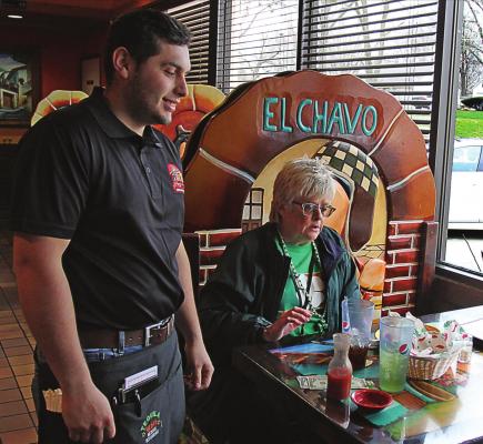 AT TEQUILA JALISCO Mexican Restaurant in Richmond, the doors last week remain open and Heraldo Hacentio waits on a customer, Janis Kincaid, Excelsior Springs. On Tuesday, the commission ordered restaurants to close their doors to walk-in customers. J.C. VENTIMIGLIA | Staff