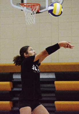 JUNIOR ANELA FLETCHER works on her bump passing during an Aug. 10 Orrick volleyball practice session in the Orrick High School gym. SHAWN RONEY | Staff