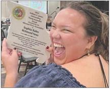 AWARD IN HAND, Sophia Bales shows her excitement. DELVA HUTTO | Staff