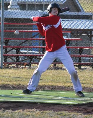 RICHMOND JUNIOR Josh Pyle, an infielder and a pitcher, takes an inside pitch during practice March 3 at Southview Park. SHAWN RONEY | Staff