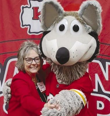 STATE REPRESENTATIVE Peggy McGaugh shows her support of the Kansas City Chiefs by embracing the Kansas City Wolf. Submitted