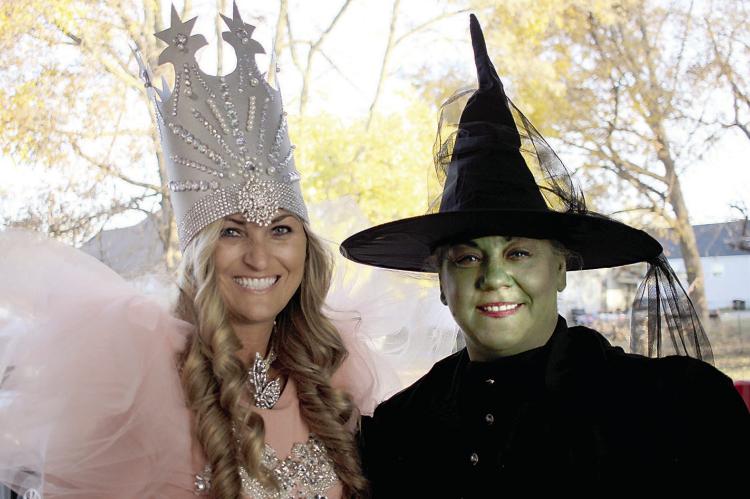 Haley Williams as Glinda the good witch and Tonya Willim, the wicked witch of the west were at the drive-through trick or treating with the City of Richmond and the fire department on Halloween evening. SOPHIA BALES | Staff