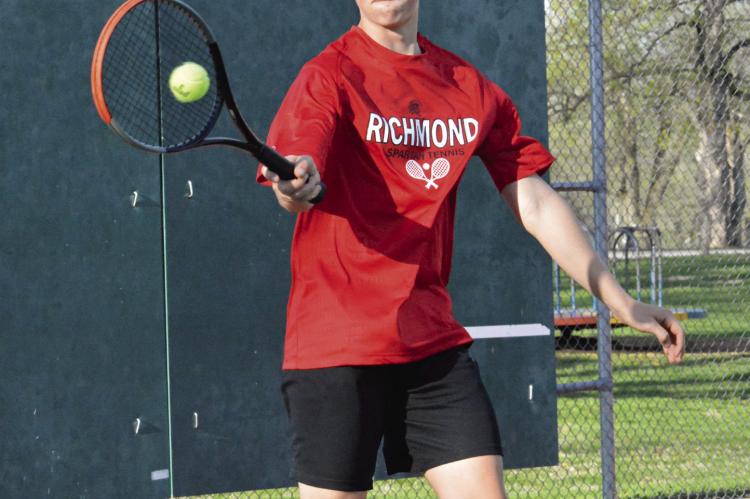 BRODY BURNINE hits a forehand shot during his No. 5 singles match with Cameron’s Ethan Turner April 13 at Maurice Roberts Park. SHAWN RONEY | Staff