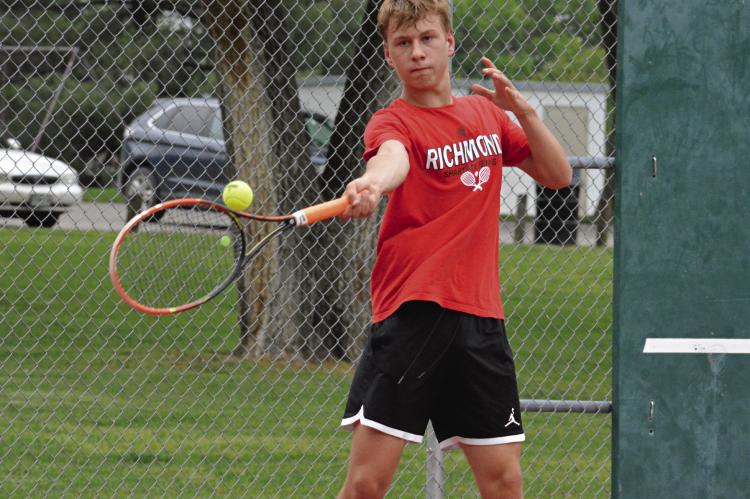 FELIX DE HESSELLE coolly keeps his eye on the ball as he hits a forehand shot from around the baseline during his singles sectional match with Excelsior Springs’ Carter Pitts May 12 at Maurice Roberts Park in Richmond. SHAWN RONEY | Staff