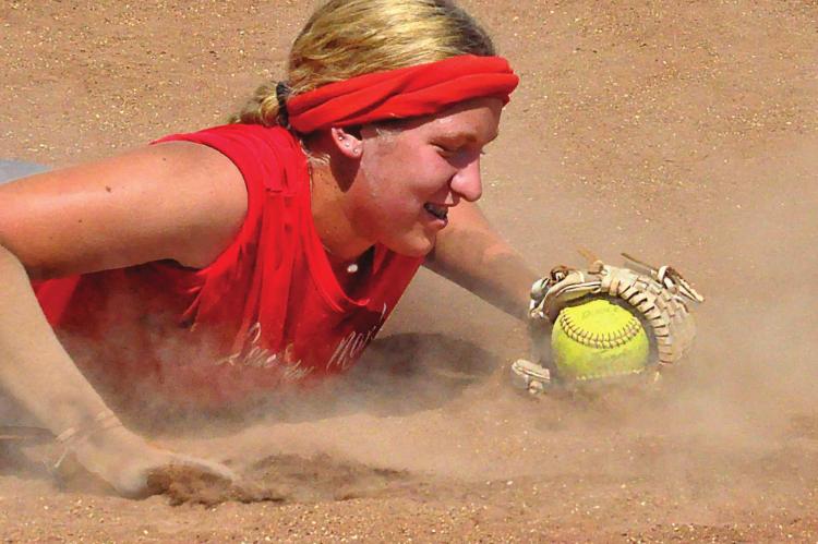 HAYLEE WEBER hits the dirt during a Richmond softball practice Aug. 21 at Southview Park. SHAWN RONEY | Staff