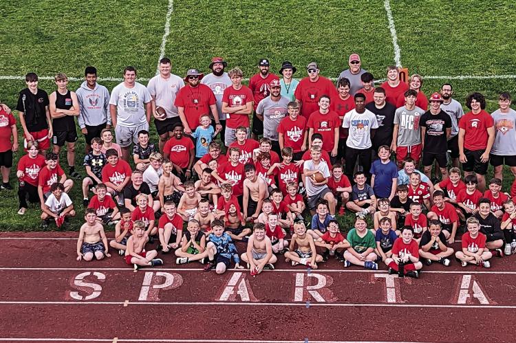 COACHES, STUDENT ASSISTANTS and campers gather near the north end zone at Spartan Stadium for a Richmond futures camp photo. COURTESY OF THE RHS FOOTBALL PROGRAM | Submitted