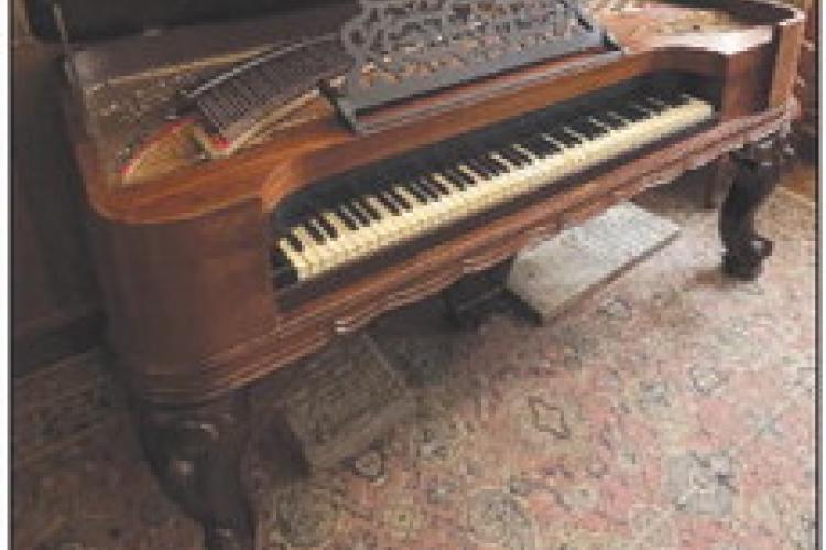 The Richmond Hotel was thriving in the 1800s, but it later burned down. The 1870s Knabe Square Grand Piano, which was recently tuned for use at local events, once belonged to the hotel, according to Ray County Museum Cathy Gottsch. SOPHIA BALES | Staff