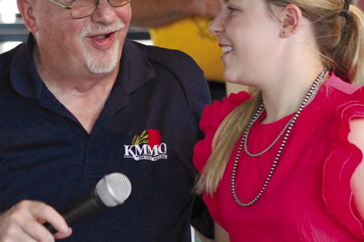 KMMO REPRESENTATIVE Larry Smith (left) presents a belt buckle to Allison Coats of Richmond, recognizing her hard work within the FFA organizations.