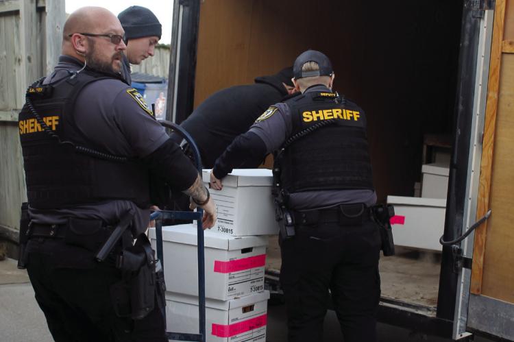 RAY COUNTY SHERIFF jailers and deputies place records in an enclosed trailer to go to the sheriff’s department on Tuesday. SOPHIA BALES | Staff