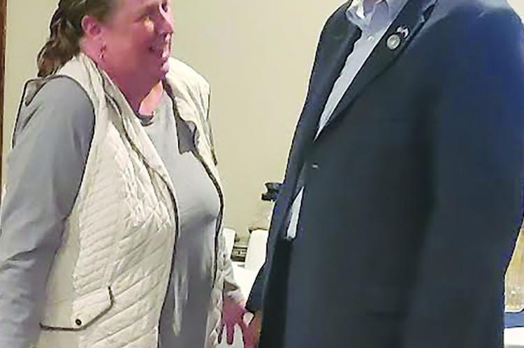 JANEY TAYLOR (left) chats with State Representative Terry Thompson during an afterhours hosted by Community Bank of Missouri and Shirkey Golf Course.