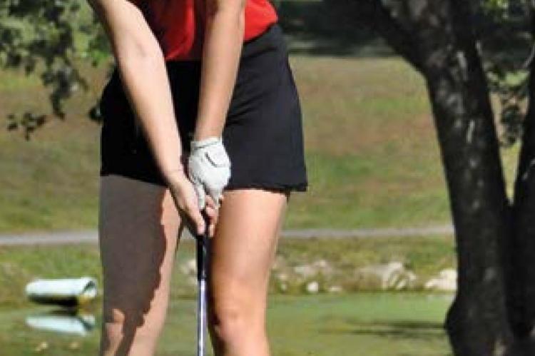 RICHMOND SENIOR Hannah Norris attempts a late-round putt during the Class 1 District Tournament Monday at Shirkey Golf Course.