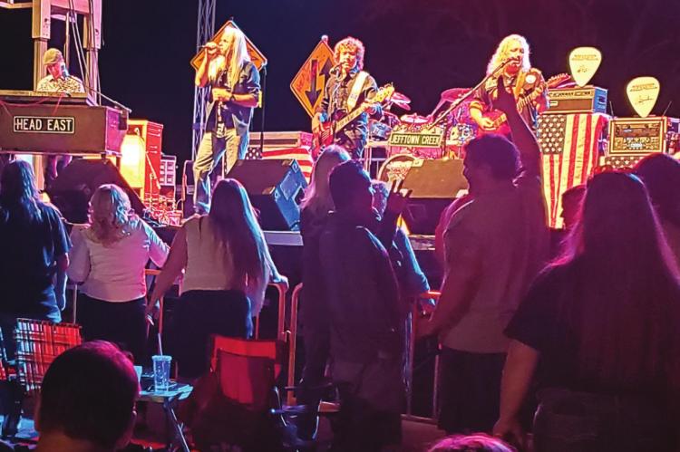 HEAD EAST, known for hits including “Never Been Any Reason,” plays in Richmond on the stage created by Branded Steakhouse, Oink &amp; Moo BBQ &amp; Taproom. Restaurant owner Randy Huffman says there is more to come. JANIS KINCAID